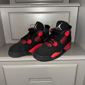 Hardly worn. Red thunder jordan 4.